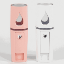 Load image into Gallery viewer, Compact white Nano Mist Sprayer with USB charging cable on white background