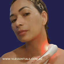 Load image into Gallery viewer, Woman using Femvy LED Glow Wand light therapy device on neck for skin treatment